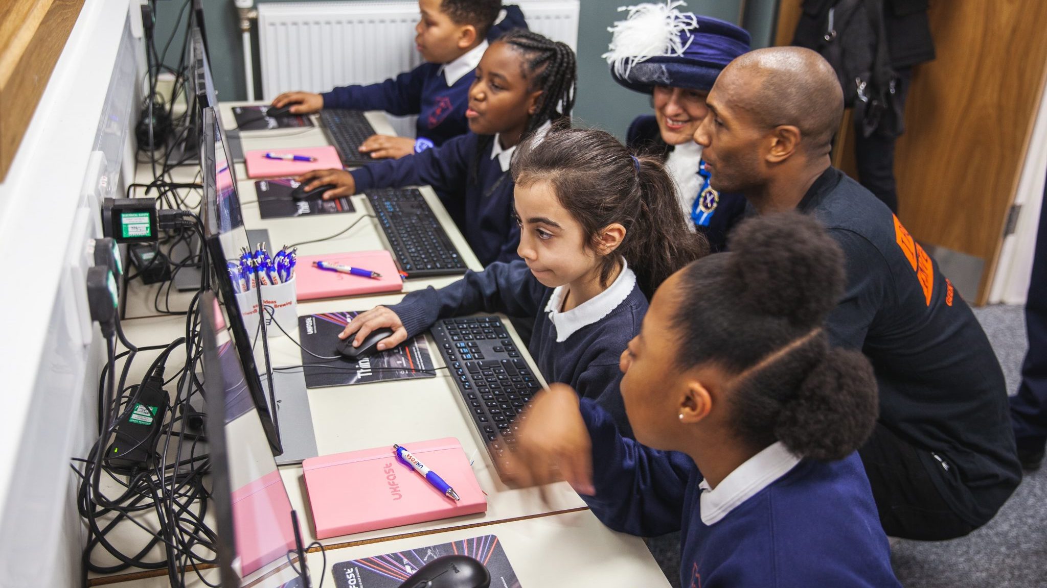 UKFast's Aaron Saxton with school children using Rasberry Pi's